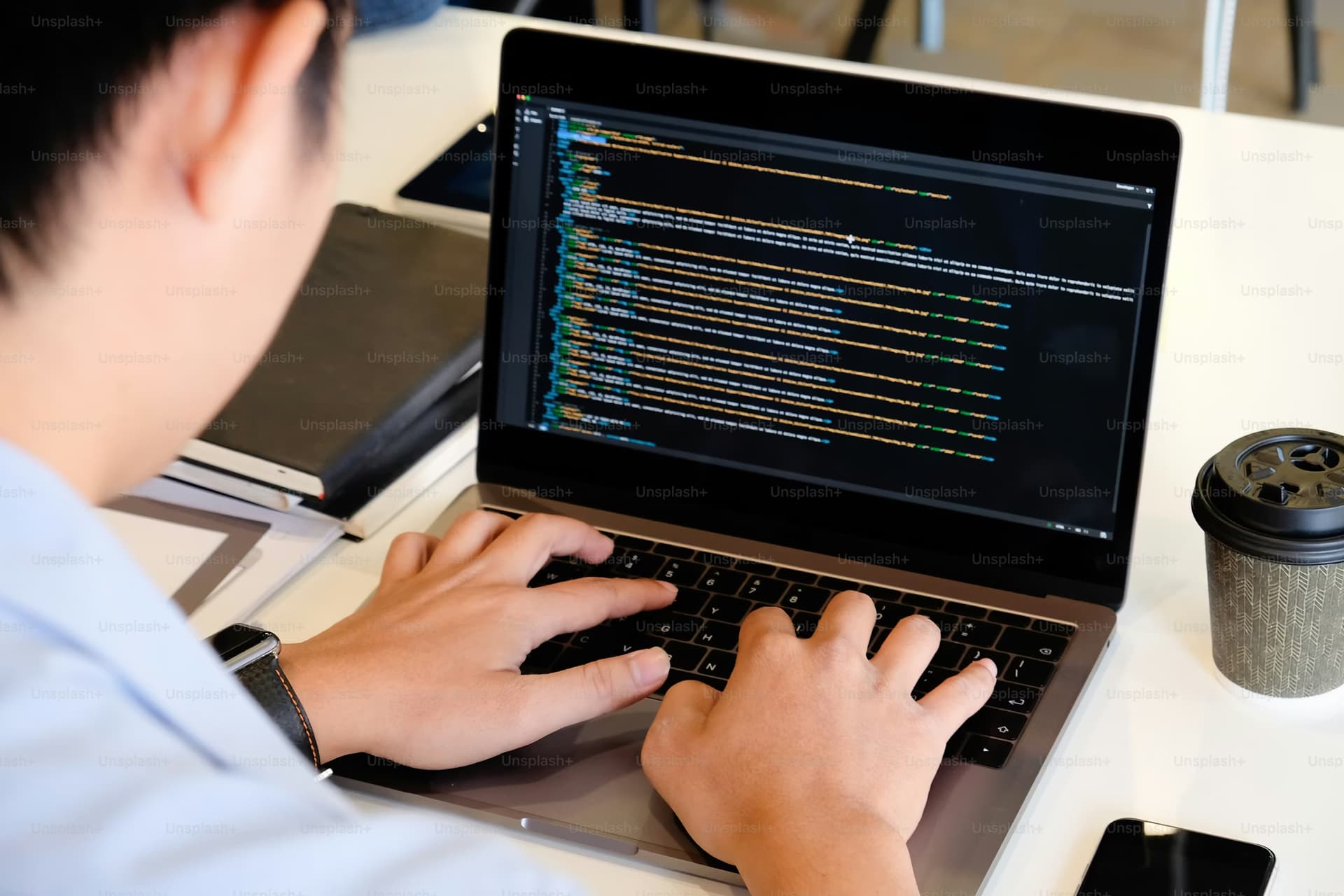 Developer working on code with modern development tools